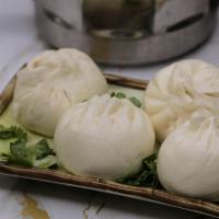 Pan Fried Pork and Vegetable Buns · Buns filled with pork and cabbage. Pan fried. 4 Buns 