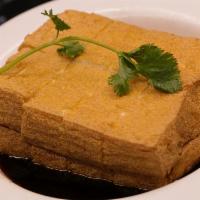 Soy Sauce Brine Tofu · Deep fried whole tofu. then sits in soy sauce.  Similar to japanese agedashi tofu 