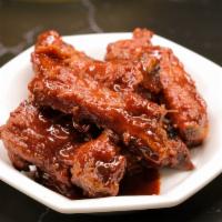 Coffee Pork Ribs · Bone in Pork ribs with a sauce made with coffee. Family size, Ala Carte.

Not an accurate or...