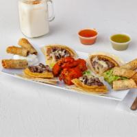 Botana Mix · Combination plate with sopes, taquitos, quesadillas, and Buffalo wings, guacamole, sour cream.