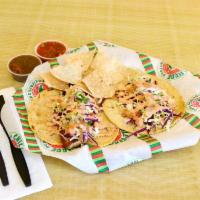 Shrimp Taco · Our shrimp taco consist soft tortilla shell filled with grilled shrimp and is topped with ca...