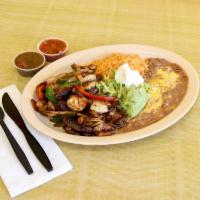 Trio Fajitas · Our signature trio fajitas is a mix of steak, chicken and shrimp grilled with bell peppers a...