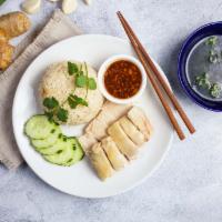 Classic (Khao Man Gai) · Chicken meat served with ginger rice, soy paste sauce, and slices of cucumber. Comes with br...