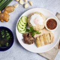 Ultimate · Chicken meat served with ginger rice, slices of cucumber, liver, and a poached egg, with dou...