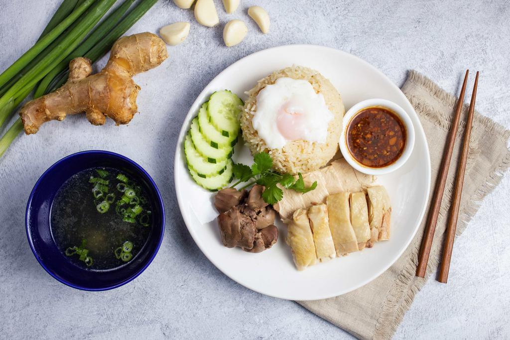 Ultimate · Chicken meat served with ginger rice, slices of cucumber, liver, and a poached egg, with double sauce. Comes with broth.