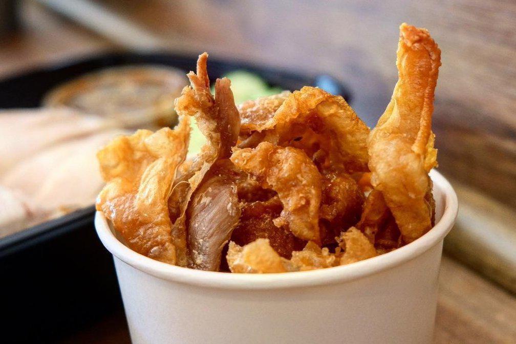Cluckins · Fried chicken skins served with sweet and sour sauce