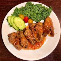 Tamarind wings · Fried chicken wings (4) served with spicy tamarind sauce.