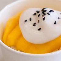 Mango with Sweet Sticky Rice · Mango over sticky rice topped with sweet coconut milk and black sesame in an 8 oz cup. The p...