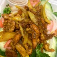7. Lemongrass Chicken Salad · Stir fried Lemongrass chicken served on a bed of romaine lettuce, cucumber, tomato, onion, a...