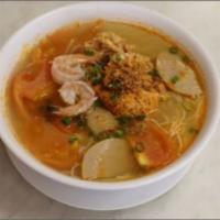 13. Crab Noodle Soup · Bun rieu. Tomato based broth, steamed pork, crab, shrimp, pig blood, tofu, tomato, and vermi...