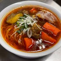 15. Beef Stew  · Vietnamese Bo Kho. Stewed beef, carrots, tendon, served with choice of French bread, vermice...