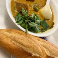 16. Chicken Curry · Ca Ri Ga. Chopped whole chicken, taro, served with choice of French bread, rice pho noodles,...