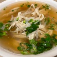 26. Chicken Pho · Shredded chicken breasts served over bed of pho noodles topped with ginger, white and green ...