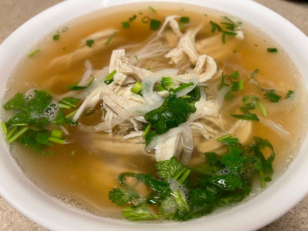 26. Chicken Pho · Shredded chicken breasts served over bed of pho noodles topped with ginger, white and green onion.