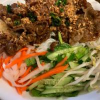 42. BBQ Pork Vermicelli · Served with lettuce, cucumber, basil, bean sprouts, pickled veggies, mint, fried onion flake...