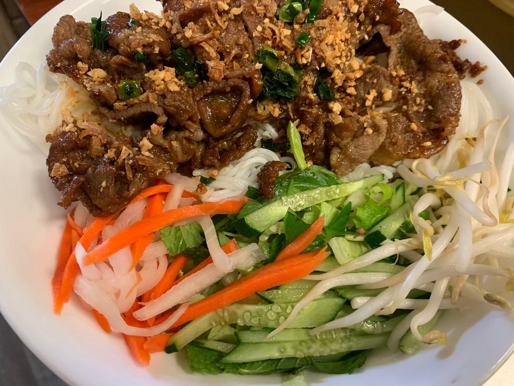 42. BBQ Pork Vermicelli · Served with lettuce, cucumber, basil, bean sprouts, pickled veggies, mint, fried onion flakes, peanuts, and house made fish sauce