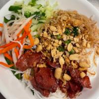 44. BBQ Pork and Shredded Pork Vermicelli · Served with lettuce, cucumber, basil, bean sprouts, pickled veggies, mint, fried onion flake...