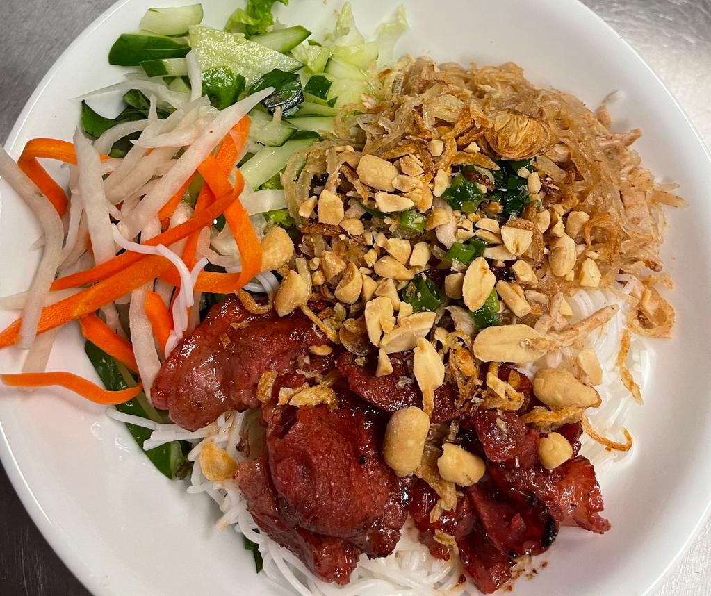 44. BBQ Pork and Shredded Pork Vermicelli · Served with lettuce, cucumber, basil, bean sprouts, pickled veggies, mint, fried onion flakes, peanuts, and house made fish sauce