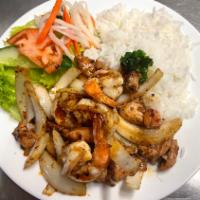 64. Chicken and Shrimp Sate Stir fry · Chicken and shrimp sauteed in our house made chili oil sate sauce tossed and fried with onio...