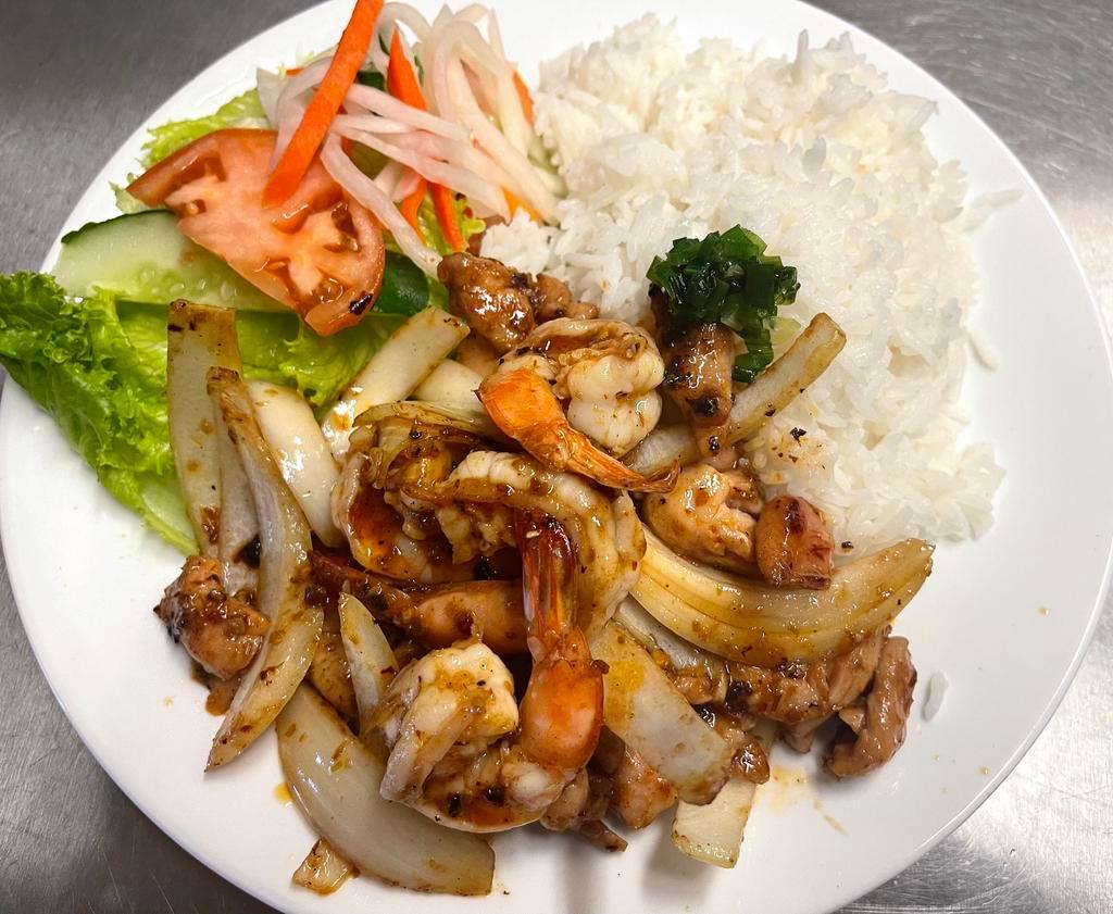 64. Chicken and Shrimp Sate Stir fry · Chicken and shrimp sauteed in our house made chili oil sate sauce tossed and fried with onions served with white rice