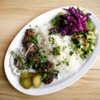 Lamb Kabob Plate · Basmati rice plate with meat, toppings and sauce. Served with pita (or tell us to skip it to...