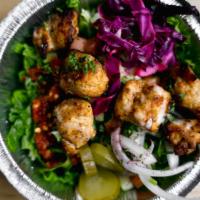Chicken Kabob Salad · A bed of romaine lettuce with meat, toppings and sauce. Served with pita (or tell us to skip...