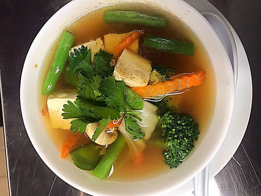 10. Vegetable Soup · Clear broth with soft tofu and vegetables.