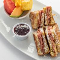 Monte Cristo · Grilled ham and Swiss cheese sandwiched between 2 extra thick slices of French toast. Served...