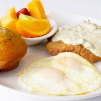 Chicken Fried Steak & Eggs · Beef patty, breaded and fried like chicken, smothered in country gravy and served with your ...