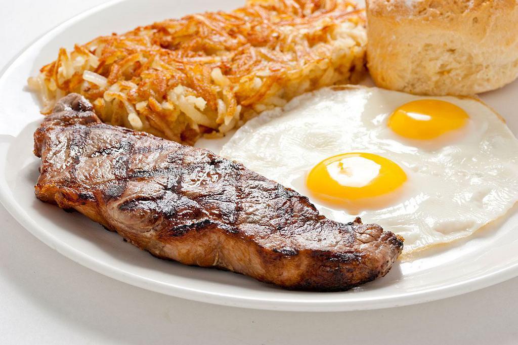 New York Steak & Eggs · 8 oz. New York steak cooked to order and served with eggs, your choice of side and bread.