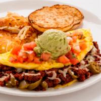 El Fuego Omelet · Spicy chorizo, jalapeno, Jack cheese. Topped with salsa fresca and guacamole.