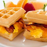 Waffle Sandwich · A Belgian waffle sandwich filled with scrambled eggs, cheddar cheese and applewood bacon.