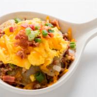 Hash Skillet · Homefried potatoes sauteed with corned beef hash, onions and bell peppers. Topped with scram...