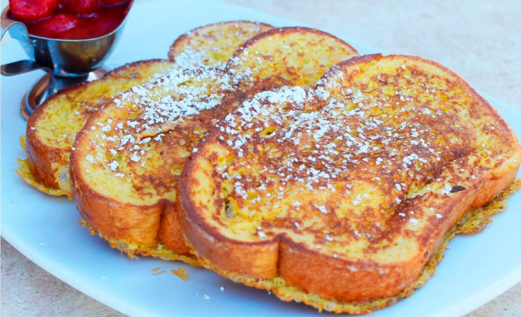 Classic French Toast · 3 extra-thick slices of bread, griddled to a golden brown, sprinkled with powdered sugar and served with strawberry sauce.