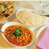 Chana Masala · Chickpeas cooked with a variety of spices and onions. Served with rice .
