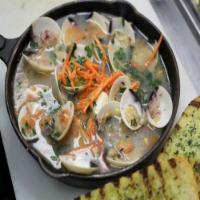 Steamed Baby Clams · 1 pound baby clams in a white wine and garlic broth.  Served with garlic bread.