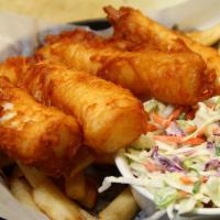 Beer Battered Fish and Chips · Fried Alaskan cod with tartar sauce and lemon wedge. 
