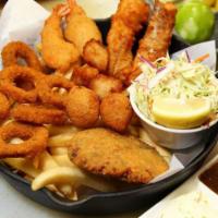 Fisherman's Basket · Beer battered cod, shrimp, calamari, crab cake, scallops, hush puppies with trio of sauces. ...