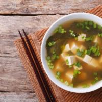 Miso Soup · Miso broth with seaweed, scallion, silken tofu. Gluten free.