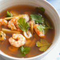 Tom Yum Soup · Spicy citrus Thai chili broth with straw mushrooms, lemongrass, chili pepper, ginger root, a...