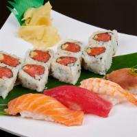 Nigiri Sushi and 4 Pieces and Spicy Tuna Roll 8 Pieces · Sushi laid top of rice.