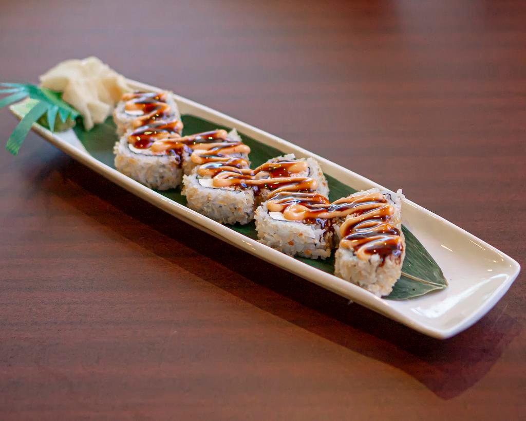 Miners Roll · Baked salmon, crab meat, cream cheese and cucumber covered with crunch batter.