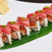 Sun's Roll · Spicy tuna, crabmeat, cucumber topped with seared ahi tuna and scallion.