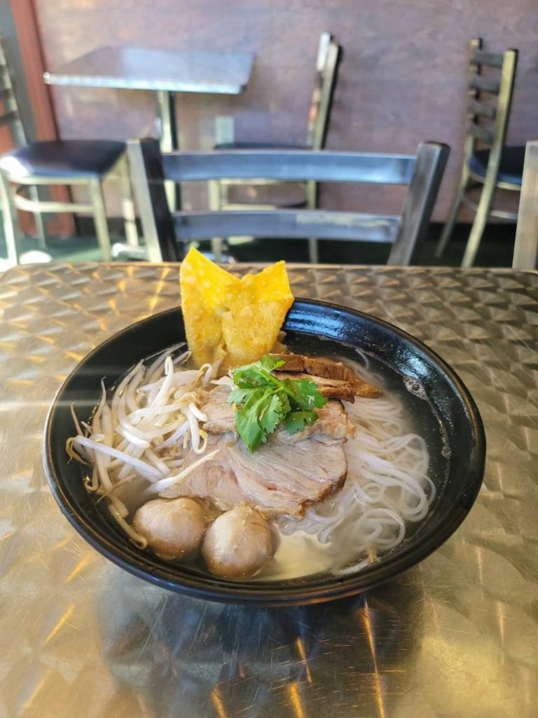 Innocent Noodle Soup · Clear broth soup with marinate pork and pork ball. topped with cilantro, bean sprout and fried wonton.