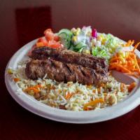 5. Adana Kebab Plate Meal · Koobideh. Served with 2 sticks, garden salad basmati rice,chickpeas and raisins. Comes with ...