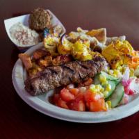6. Sam's Combo Kebab Plate · Combination of gyros and kebab and 2 pieces of falafel. Served with 2 sticks, garden salad,b...