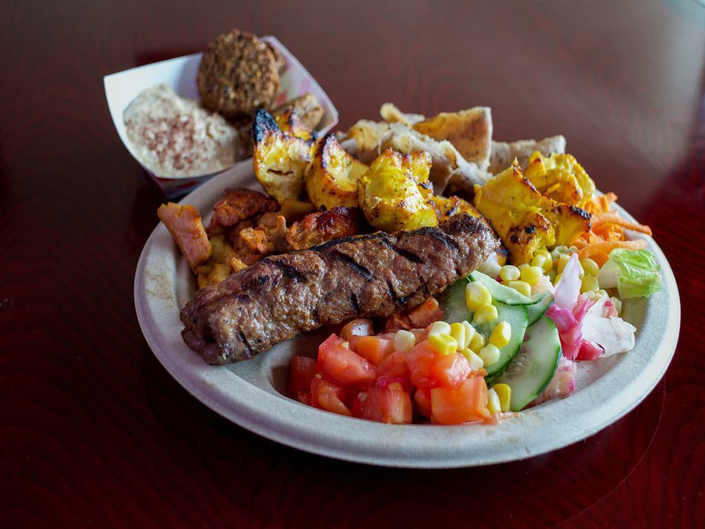 6. Sam's Combo Kebab Plate · Combination of gyros and kebab and 2 pieces of falafel. Served with 2 sticks, garden salad,basmati raice,chickpeas and raisins.