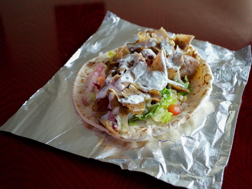 10. Lamb Beef Gyros Wrap · Served in pita bread with lettuce, tomato, cucumber, tzatziki sauce and tahini sauce.