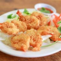 A6. Beer Battered Fried Prawns · 6 pieces of beer battered fried prawn served with sweet and sour sauce. 