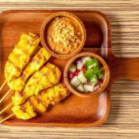A4. Chicken Satay · 4 pieces. Chicken tenders marinated in coconut milk, thai spices, char-grilled, served with ...